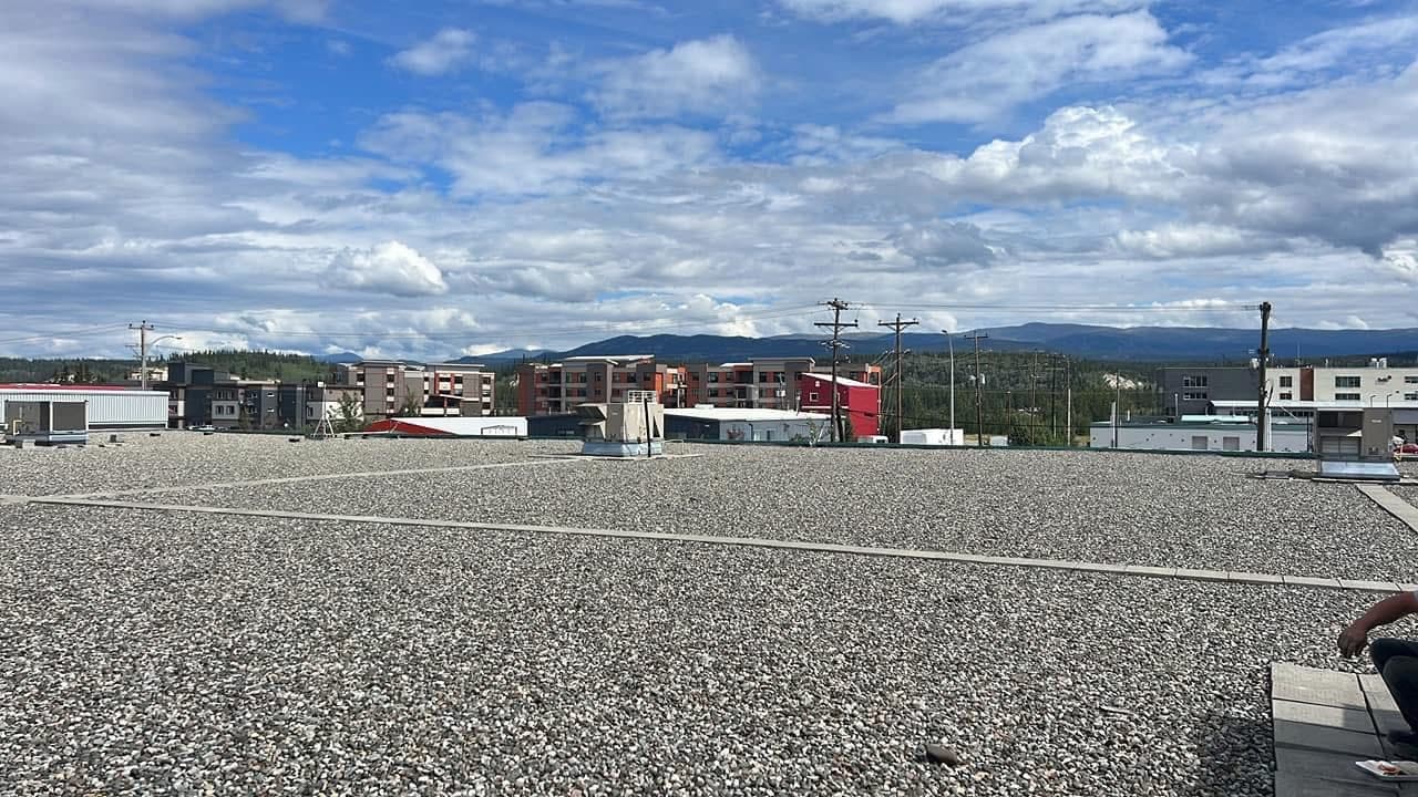 Rocky West Commercial Roofing Banner. Picture of a commerical roof.